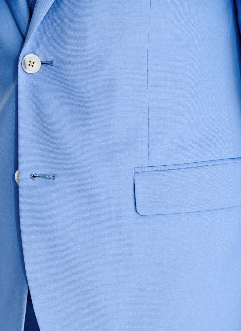 Niebieski wełniany garnitur męski